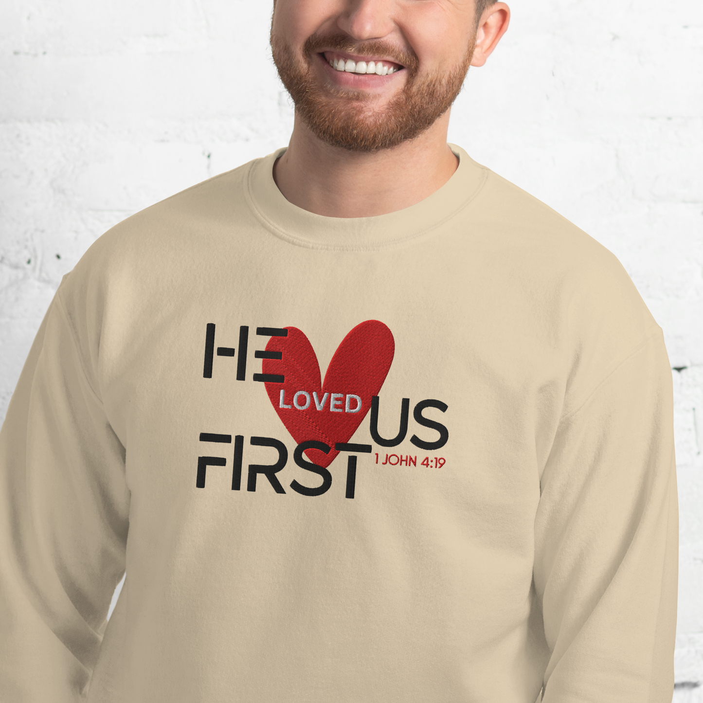 He Loved Us First Embroidered Sweatshirt